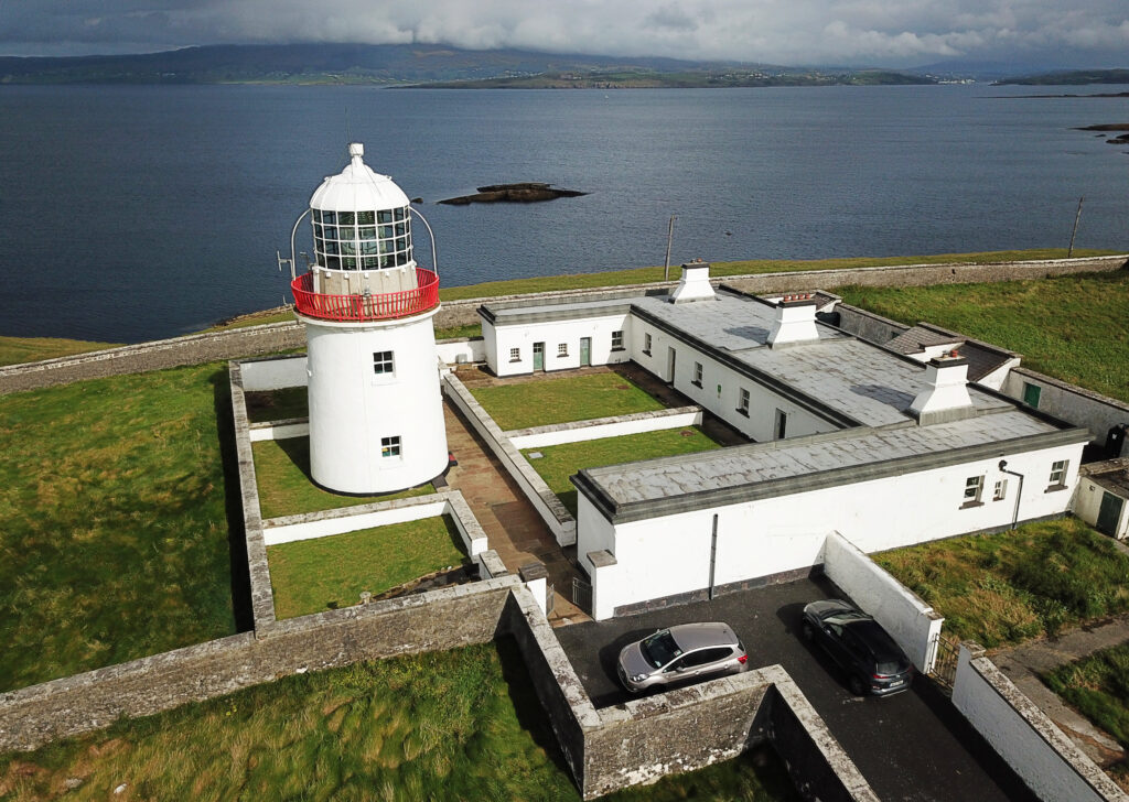 Aerial view of St. John's Lighthouse, Co. Donegal with the lighthouse to the left and the two rental houses facing it