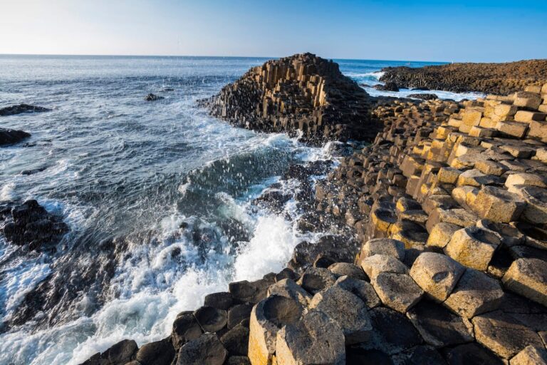 Basalt rock formations protruding from the sea at the Giant's Causeway